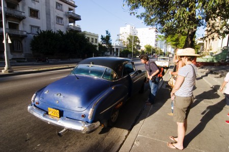 Pedro flags down an old car to take us back to the hotel. 