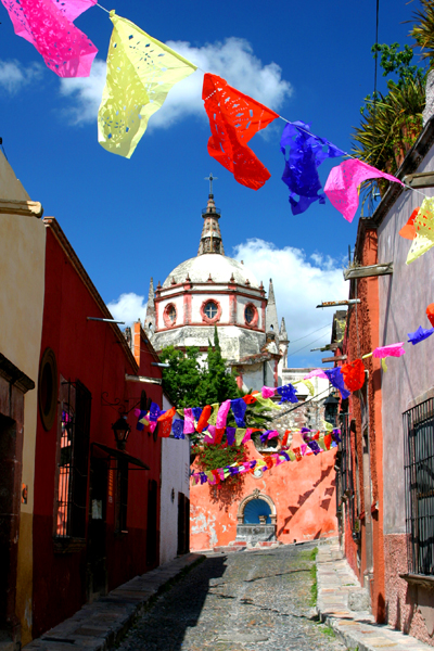 The papel picados flap in the breeze along Aldama in San Miguel de Allende. Photo by David Lansing.