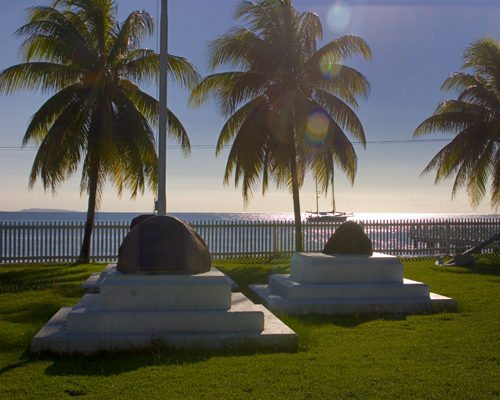 The Cession Monument where Fiji was given to England. See the sloop in the background? Photo by David Lansing.