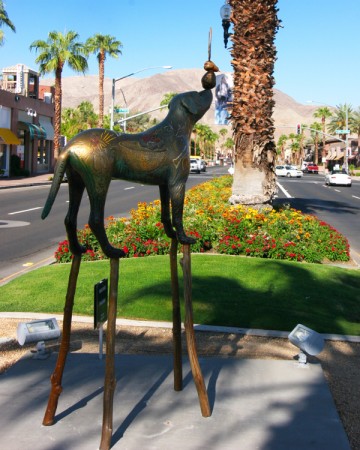 A dog on stilts in the middle of El Paseo; Brad Rude's "Trick Ride."